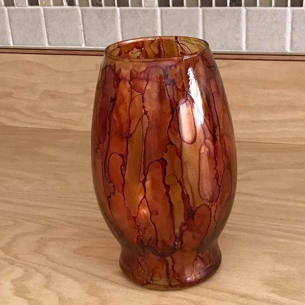 Hand crafted brown orange artisan glass vase painted with alcohol inks
